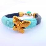 Blue Thick Leather Bracelet With A Gold Plated..